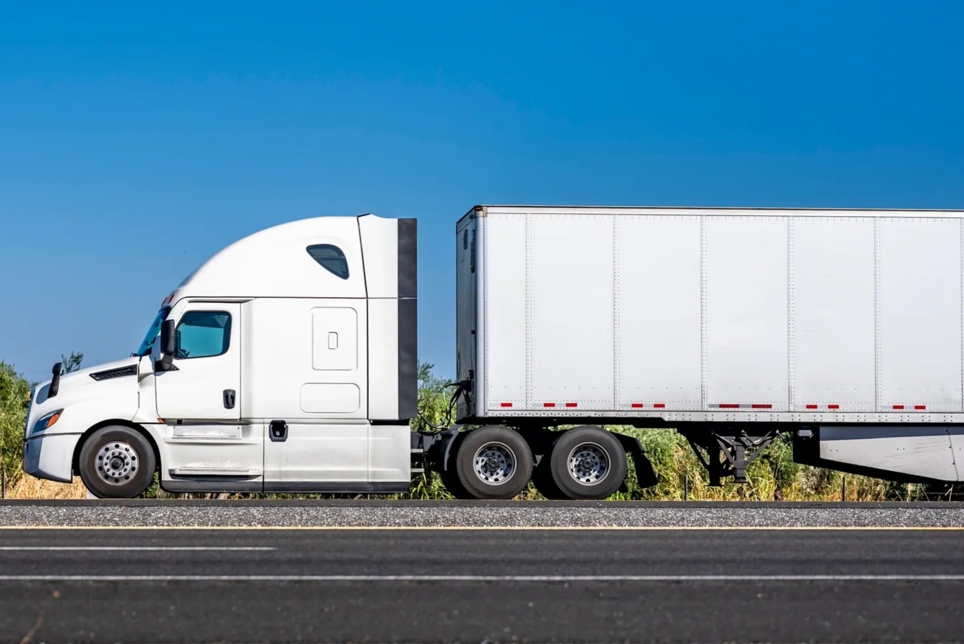 Semi truck with double trailers on highway
